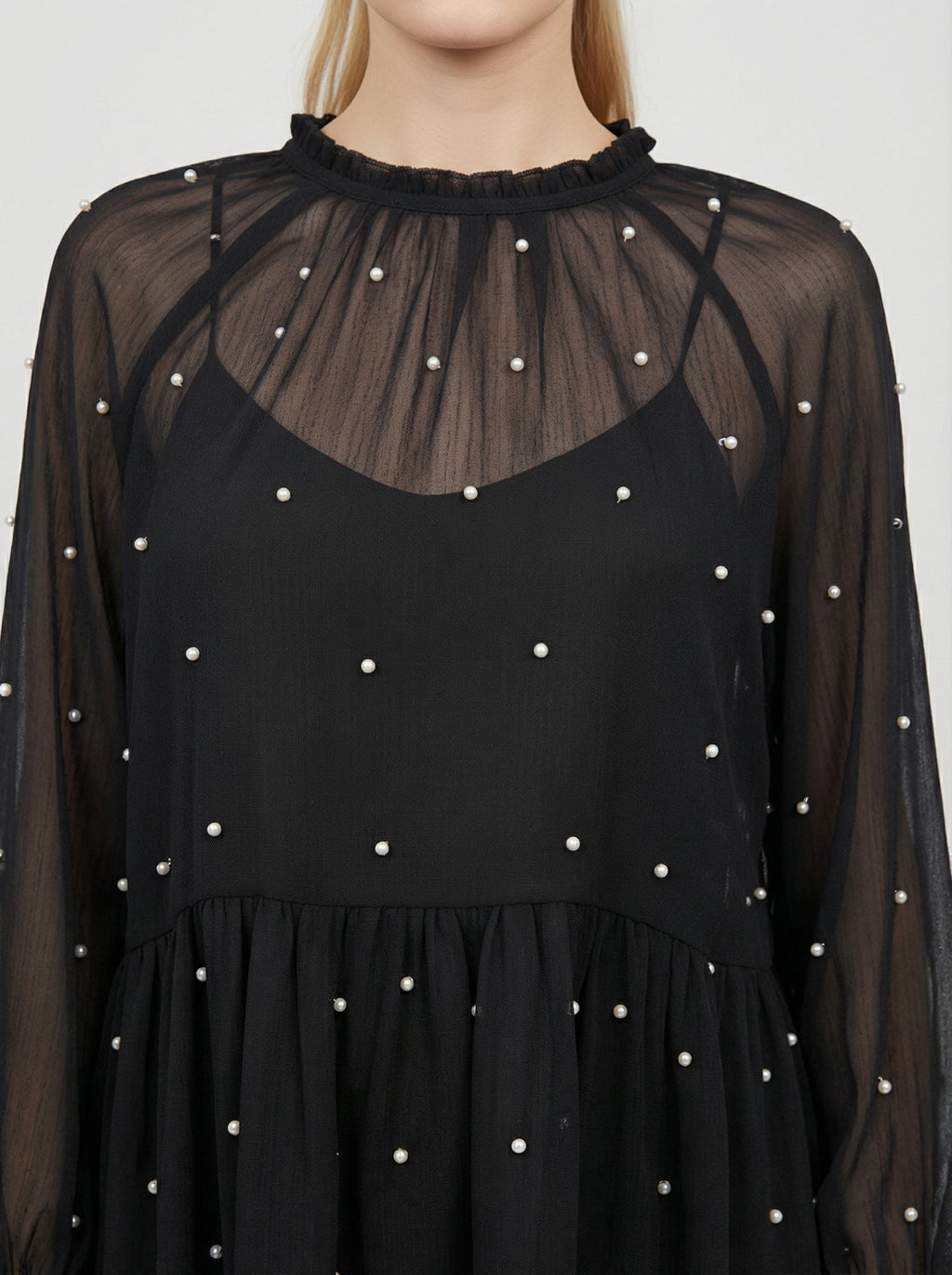 Blusa trasparente con perline