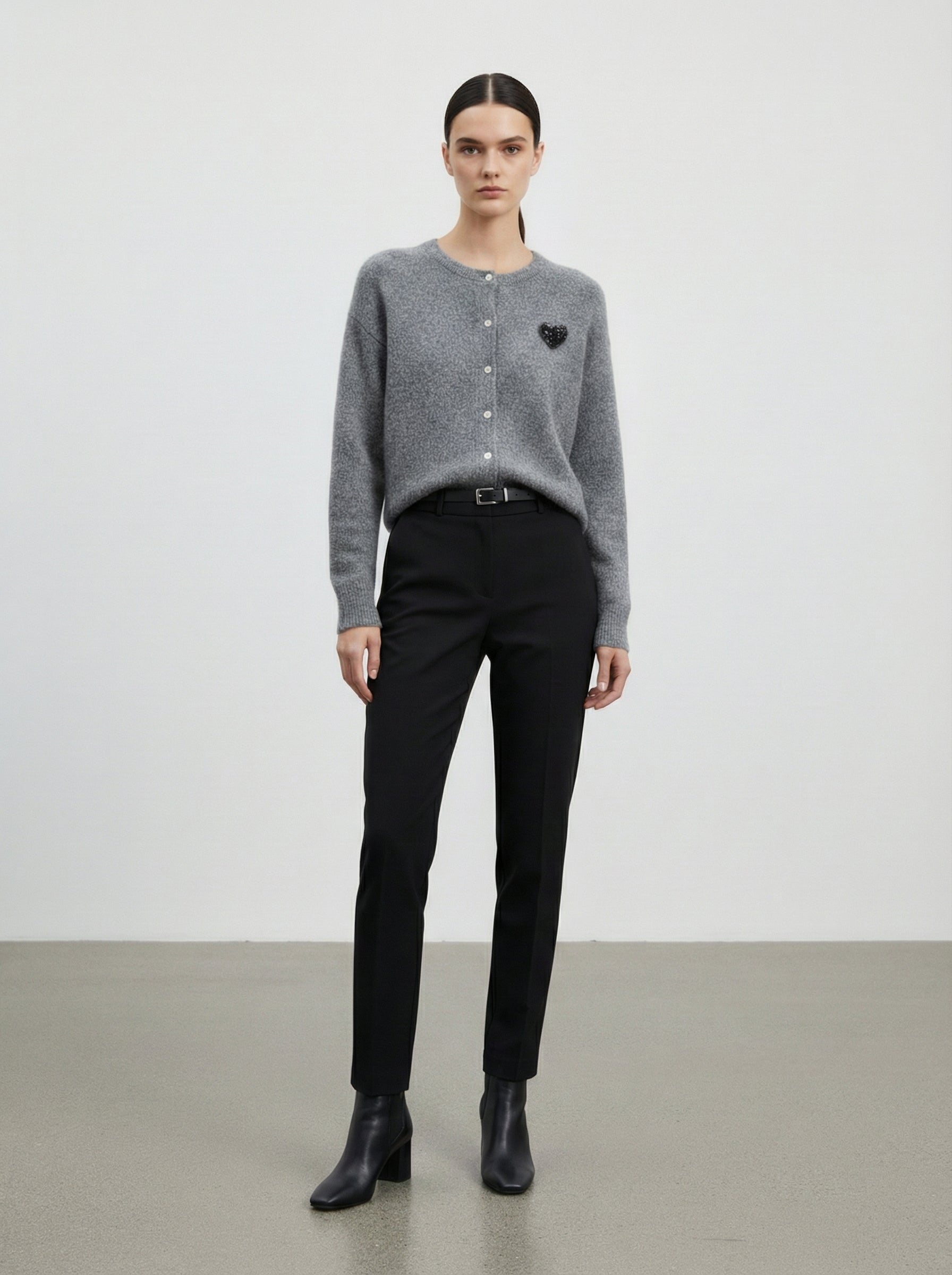 Cardigan con cuore in paillettes