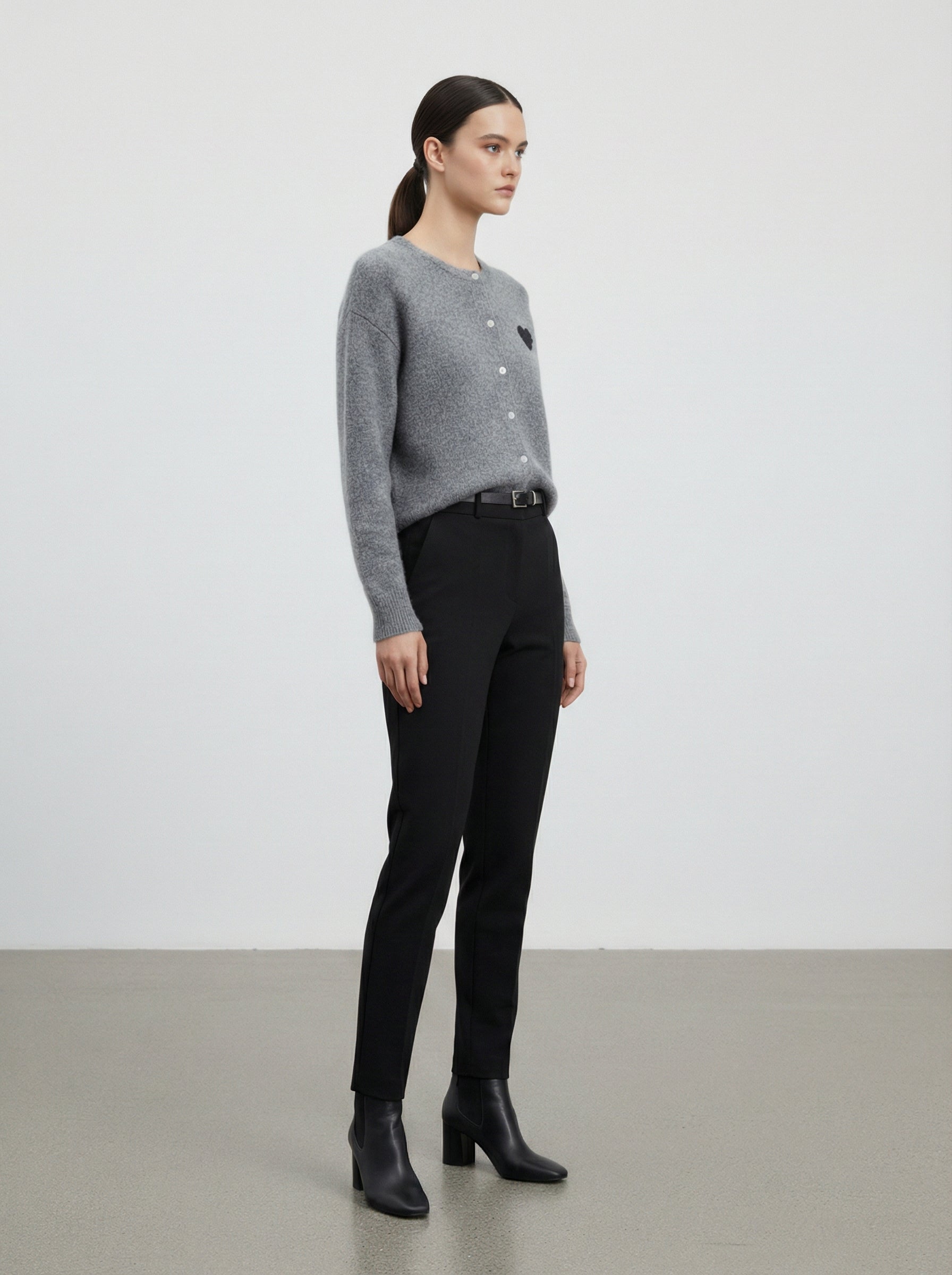 Cardigan con cuore in paillettes