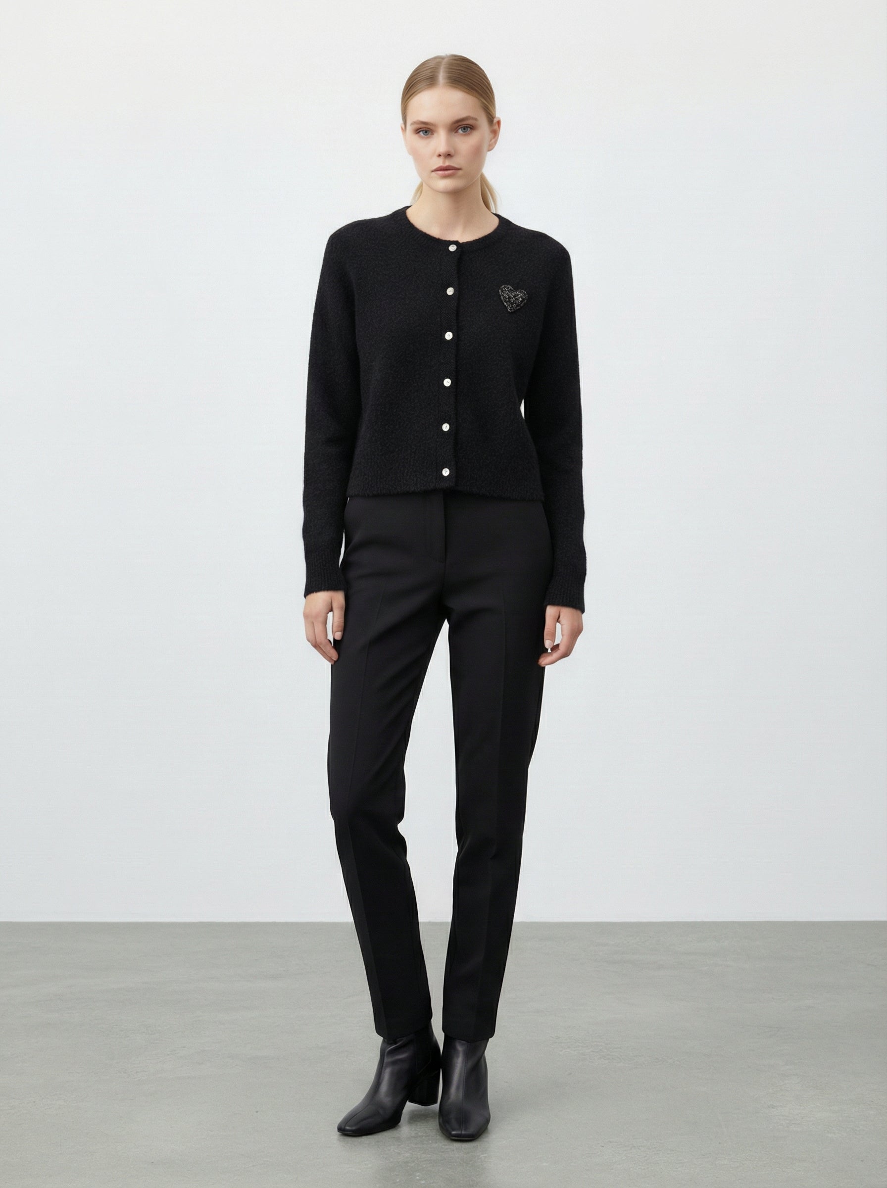 Cardigan con cuore in paillettes